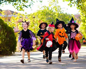 A picture of children trick or treating.