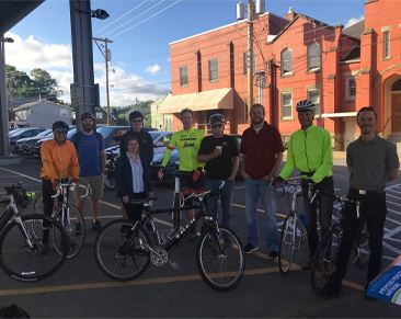 Bikers who biked to work posing for a photo.