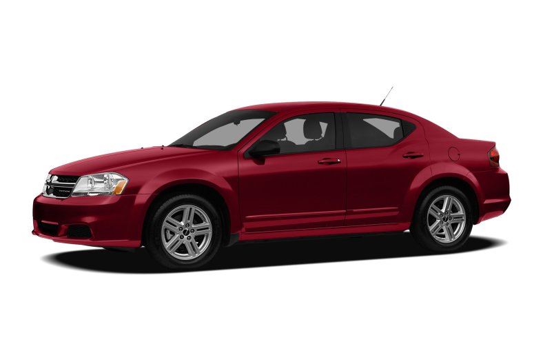 A picture of a red/maroon Dodge Avenger.
