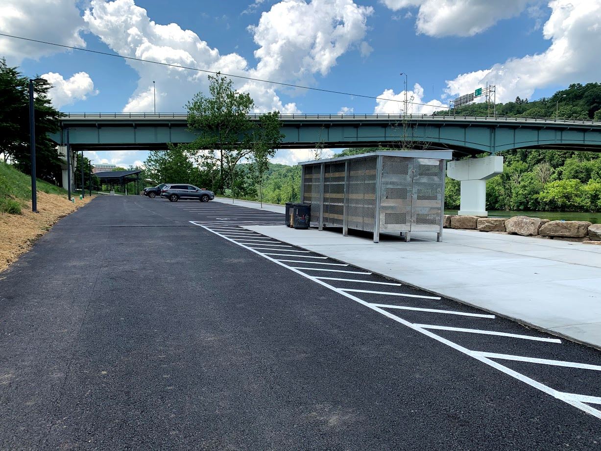 Image of kayak locker and paved parking lot at Walnut Street Landing